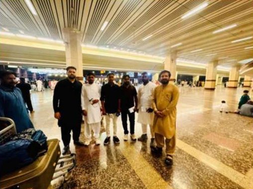 Group of workers inside the airport departure hall